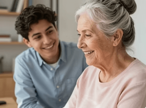 An older adult smiling with a family member.